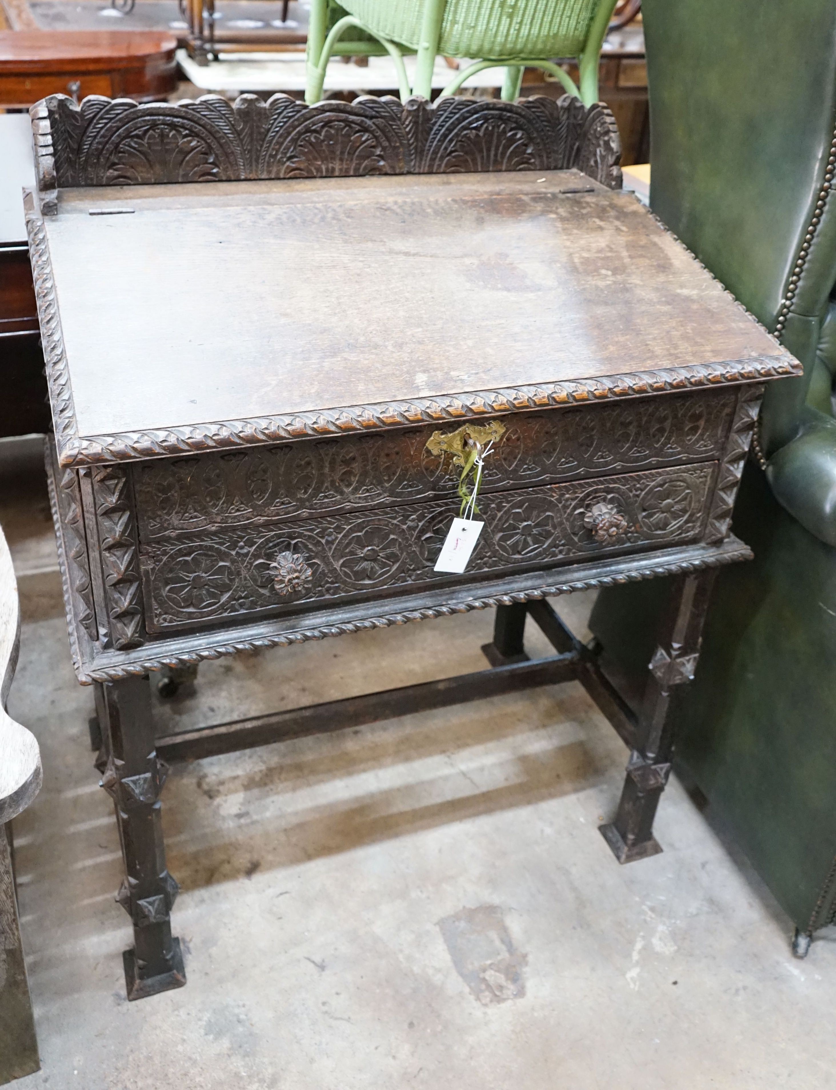 An Anglo-Indian carved oak desk, length 82cm, depth 53cm, height 103cm